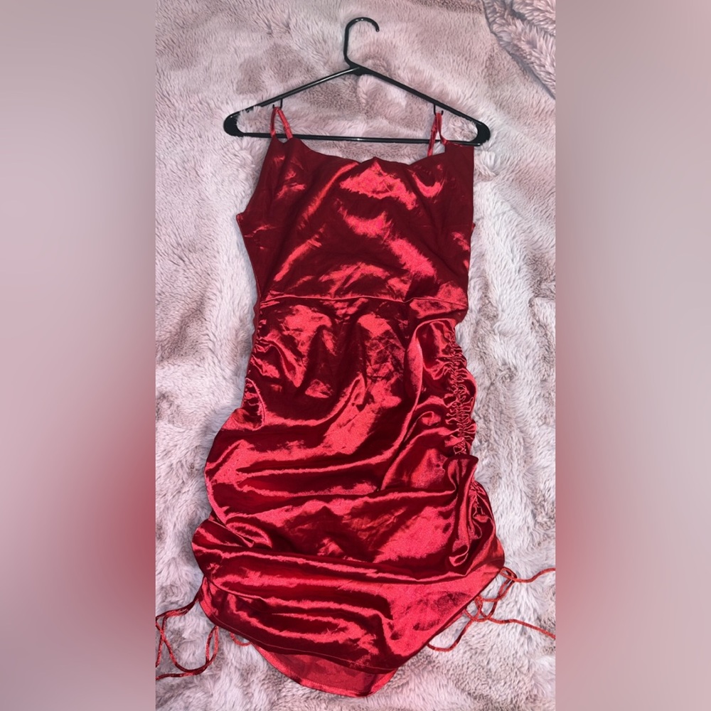 Red satin mini dress with ties.